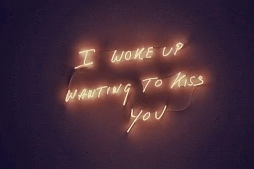 a neon sign with a message that reads, i woke up waiting to miss you