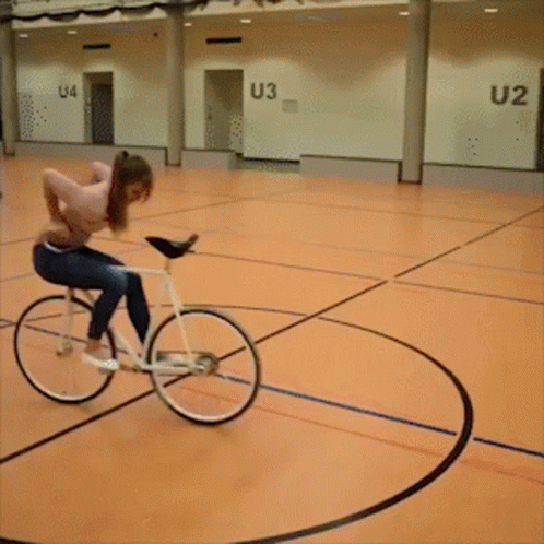 a person riding a bike inside of a building