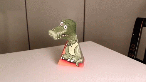 a toy of a dinosaur on top of a table