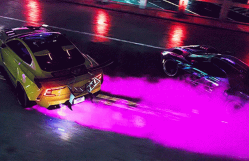 two vehicles driving down a city street while spraying purple ink on them