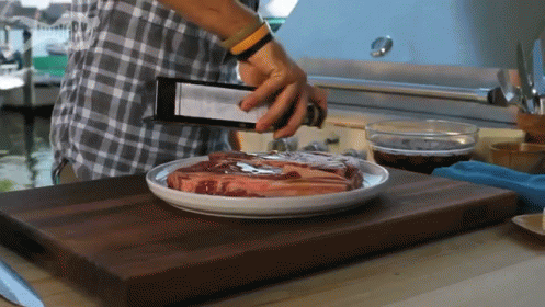 a man cuts a plate on the table