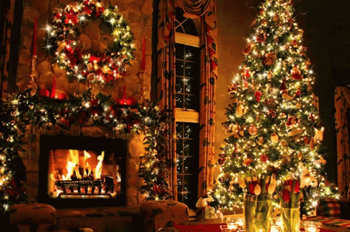 a decorated christmas tree and fireplace in the living room