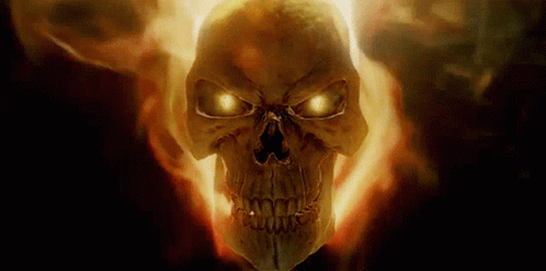 a fire skull with glowing eyes glowing through the fog