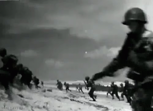 an old po of a group of soldiers running in snow