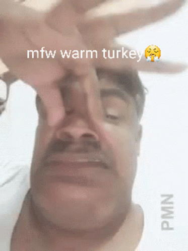 a man holding up his head with the words'new warm turkey'written on it