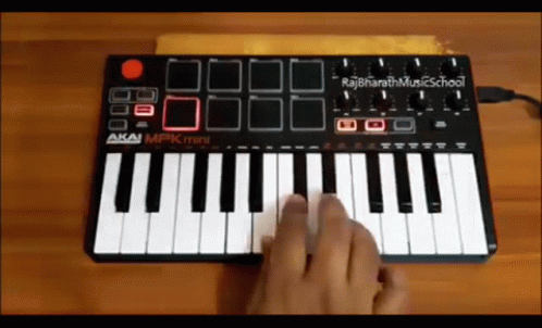 a person playing a keyboard with their fingers