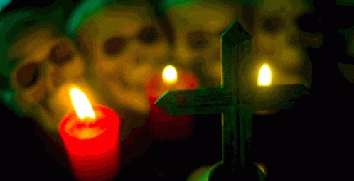 a cross in front of a row of skulls