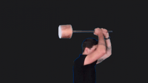 a man lifting a large object in the air