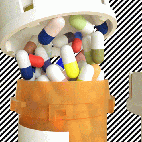 an open container filled with multicolored pills and a white lid