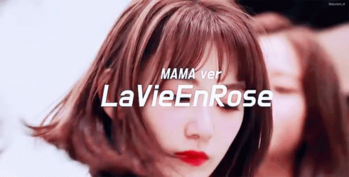 the words, mamma avery la vier rose written in white over an image of a woman with blue hair