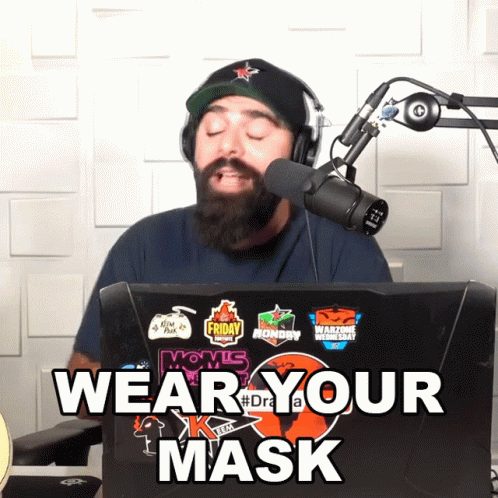 man on the computer using a microphone with words overlay that says wear your mask