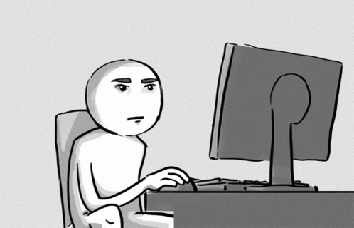 a cartoon man sitting in front of a computer
