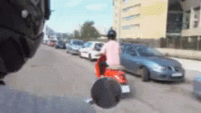 a man riding a skateboard past a parked car