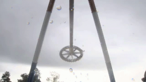 a couple of water hoses with a ferris wheel attached to it