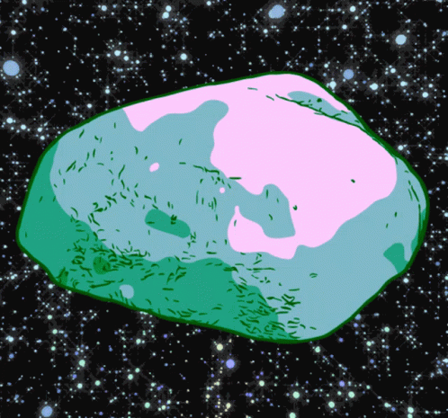 a green and white rock sitting in the center of stars