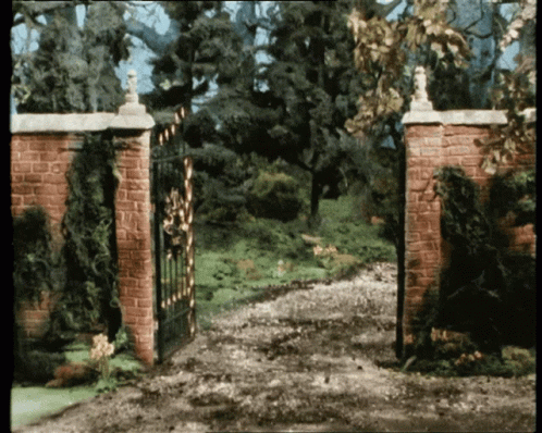 two gates that are brick with a white top