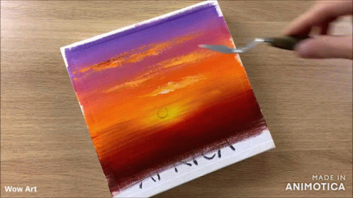 someone using paint to draw the sky in acrylic