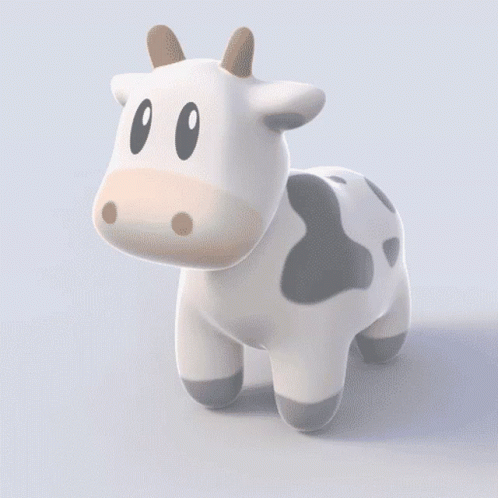 a cow toy standing with its head slightly turned