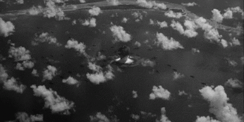 black and white pograph of clouds taken from an airplane