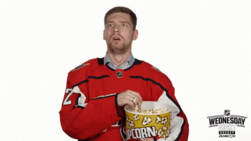 this is a picture of a hockey player holding popcorn