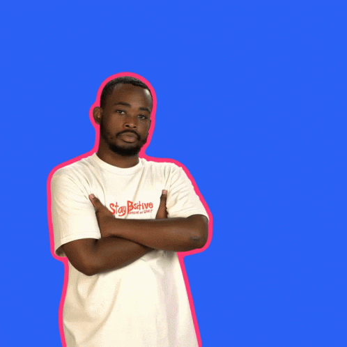 a black man with his arms crossed against an orange background