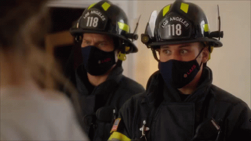two firemen in helmets, black with blue faces