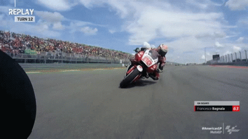 a motorcyclist turning the corner of a track