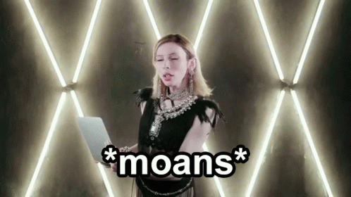 a person standing in front of a wall with lights and the word moans above them