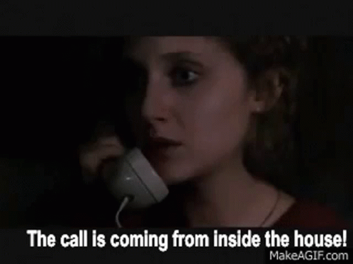the person is talking on a telephone at night