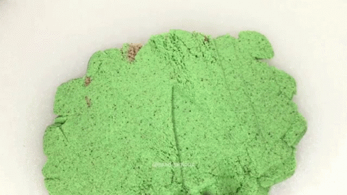 a green powder that is sitting in the middle of a counter