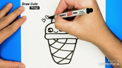 a person drawing an ice cream cone with crayon