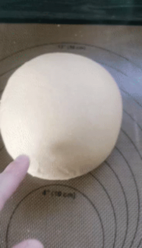someone is baking a ball in a bowl