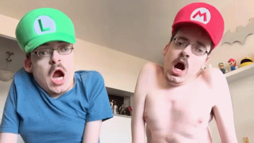 two men with their faces painted as mario and luigi