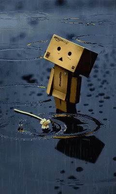 a little robot has water and is standing in the mud