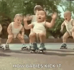 several babies riding roller blades in formation together