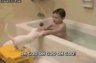 a young child in a bathtub that is not giving him a bath