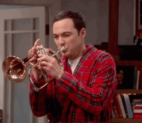 a man is playing the trumpet while playing the guitar