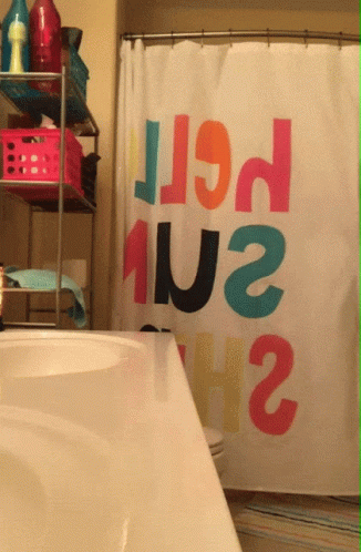 a shower curtain with the word hello sun  in it