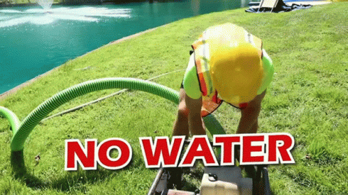 there is a large hose attached to the water in the grass