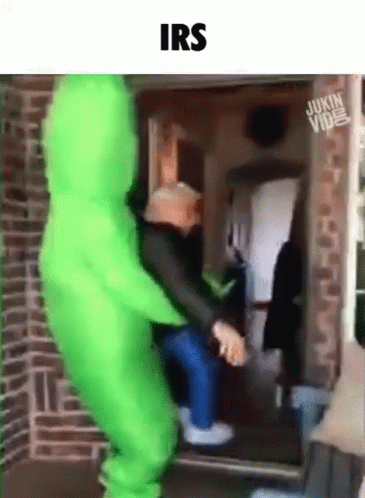 an inflatable man and woman hing into a door