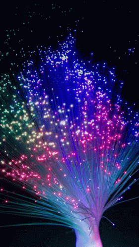 many colorful fireworks displayed on a black background