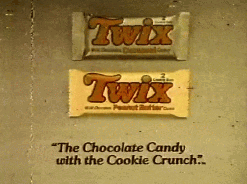 twix ad with chocolate candy in background on wall