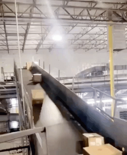 a machine is moving an object on a conveyor belt