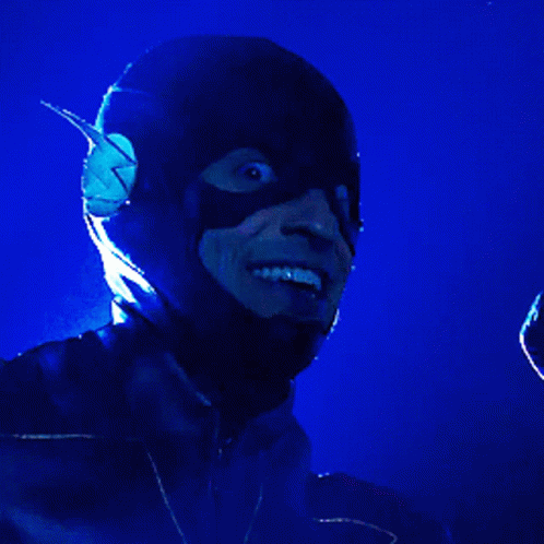 a man wearing a mask holding a microphone