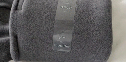 the back of a gray blanket label with text