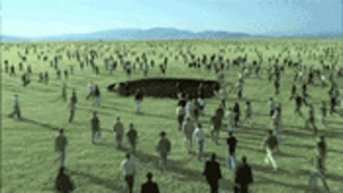 a po with several people walking around a circle shaped object