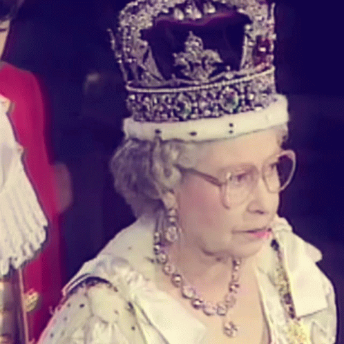queen elizabeth of england wears the crown during a television broadcast