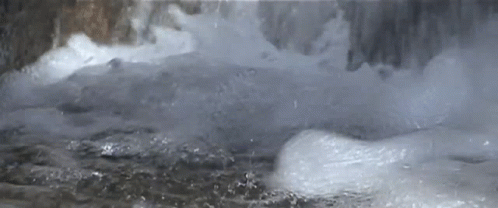 a closeup of ice and water in a waterfall