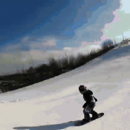 a digital picture of a snowboarder coming down a mountain