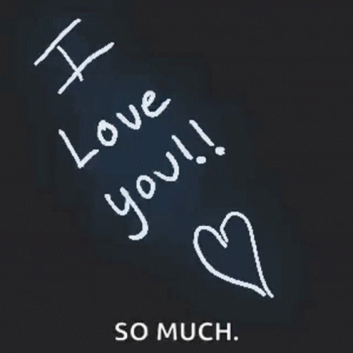 the handwritten message of i love you is written on a piece of black paper